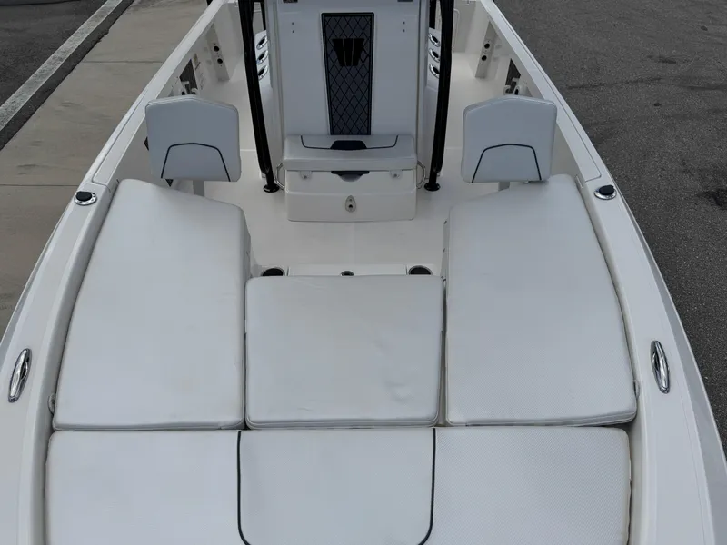 Slide: The Image of 2016 Wellcraft 241 boat interior with cushioned seating and storage compartments. - 45