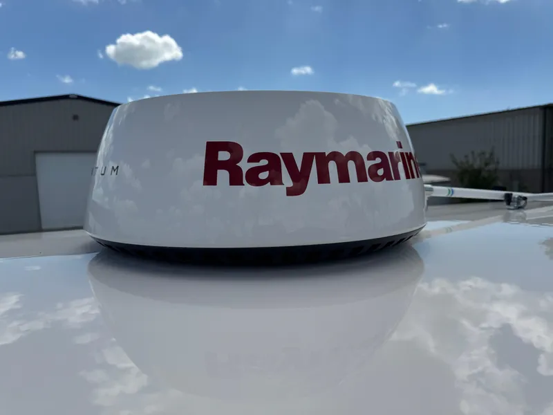 Slide: The Image of Raymarine radar on 2016 Wellcraft 241 boat under blue sky. - 48