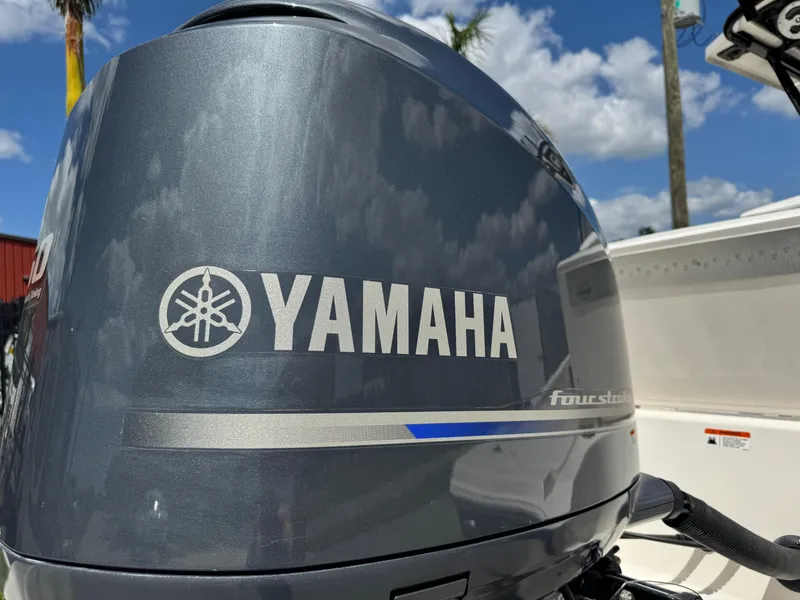 Slide: The Image of Yamaha four-stroke engine on 2016 Wellcraft 241 boat under blue sky. - 7