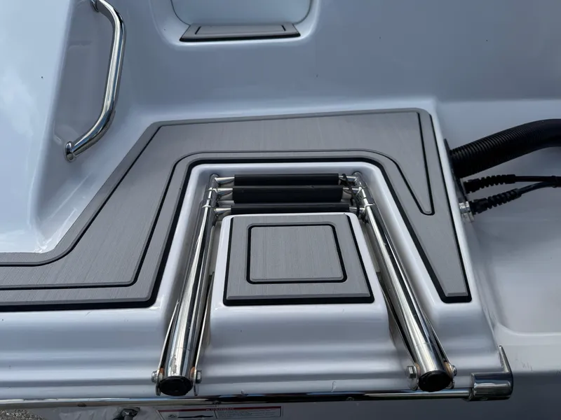 Slide: The Image of 2023 Sportsman Open 212 Center Console boat ladder and deck detail. - 10