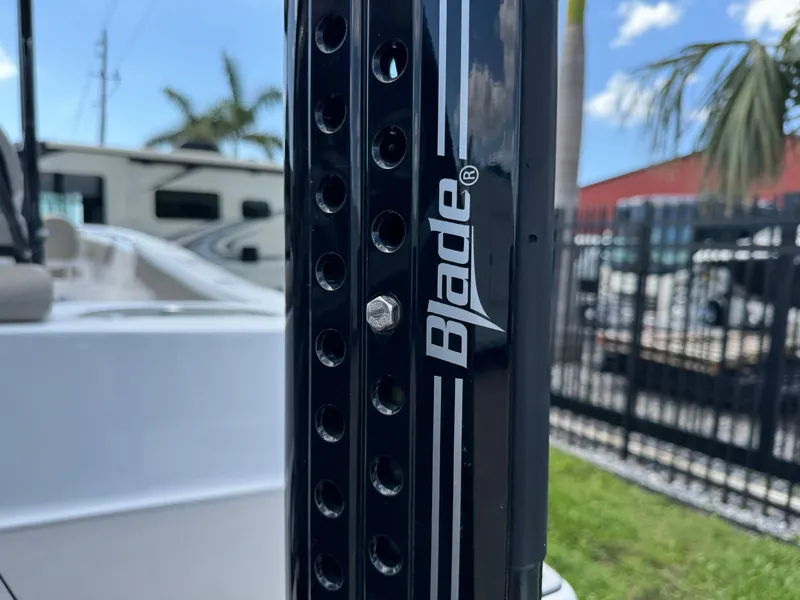 Slide: The Image of 2023 Sportsman Open 212 Center Console with Blade accessory, outdoor setting. - 12