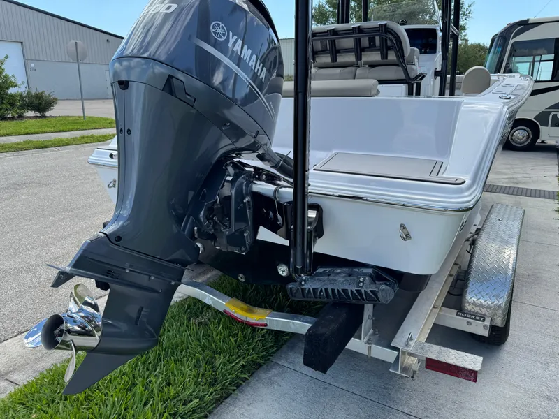 Slide: The Image of 2023 Sportsman Open 212 Center Console boat with Yamaha outboard motor on trailer. - 14