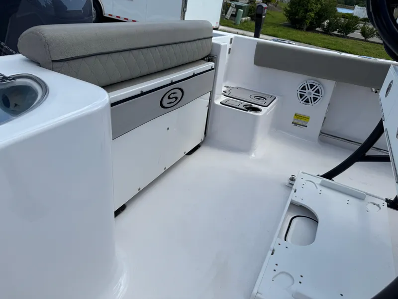 Slide: The Image of 2023 Sportsman Open 212 Center Console boat interior with seating and storage. - 19