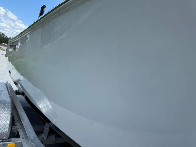 Slide: The Image of 2023 Sportsman Open 212 Center Console boat on trailer, side view. - 30