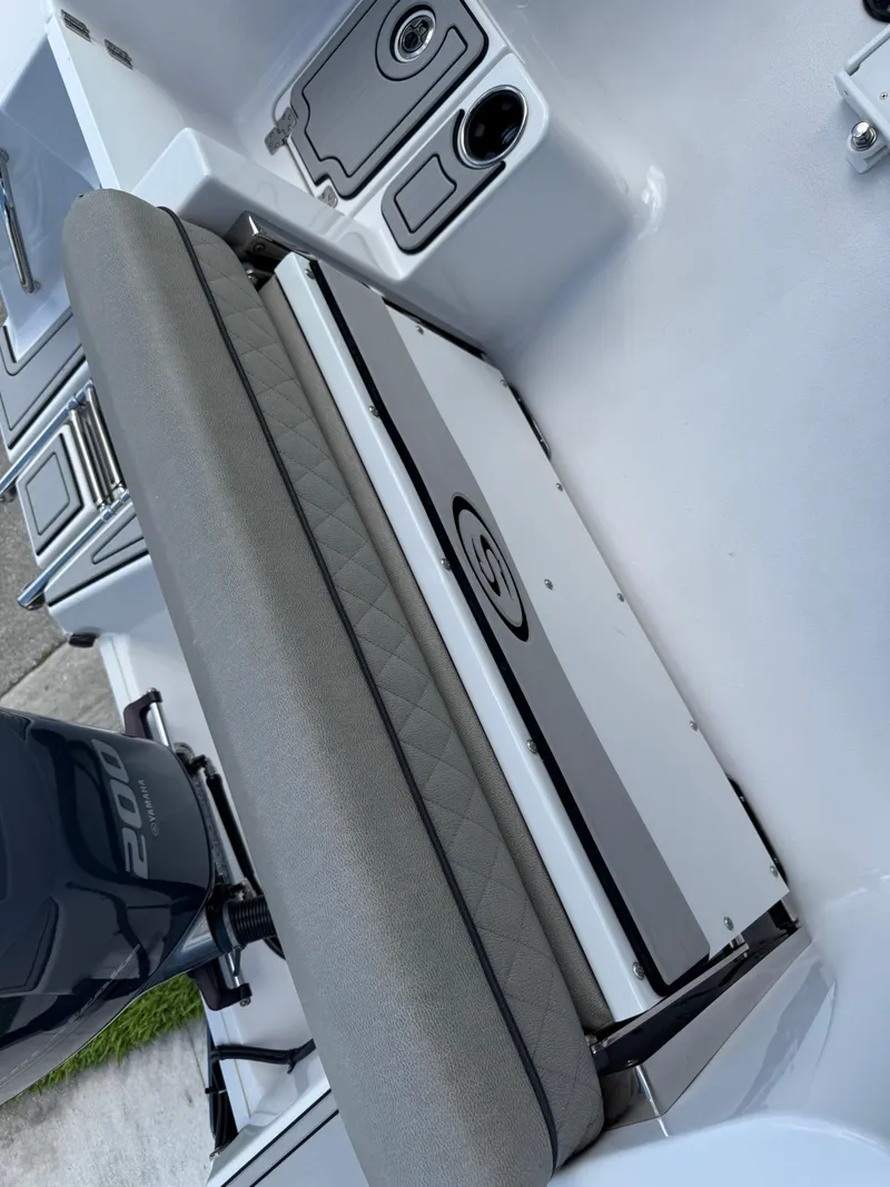 Slide: The Image of 2023 Sportsman Open 212 Center Console boat interior with seating and storage. - 33
