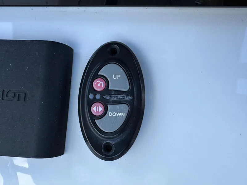 Slide: The Image of Remote control panel for 2023 Sportsman Open 212 Center Console boat, featuring up and down buttons. - 37