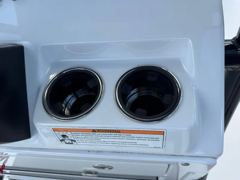 Slide: The Image of 2023 Sportsman Open 212 Center Console cup holders with warning label. - 39