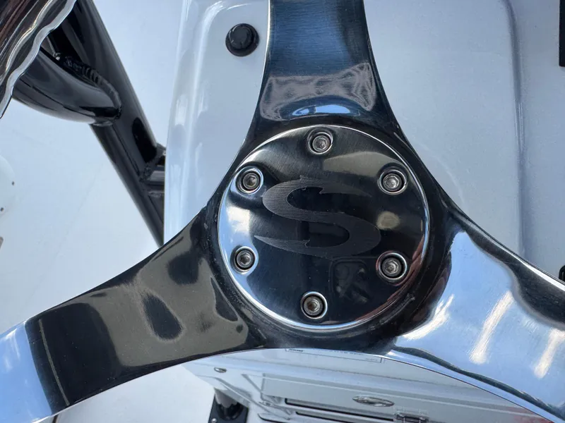 Slide: The Image of Steering wheel of 2023 Sportsman Open 212 Center Console boat, featuring sleek metallic design. - 41