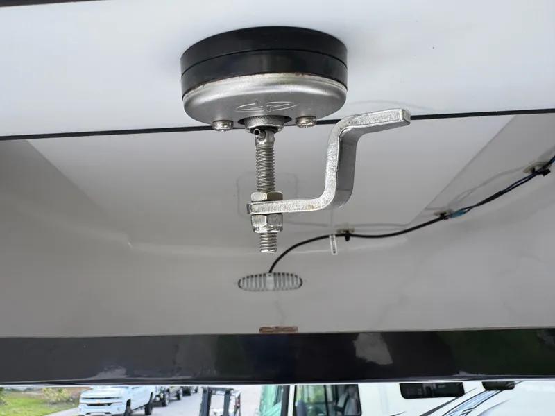 Slide: The Image of 2023 Sportsman Open 212 Center Console boat detail, featuring a mounted metal fixture. - 47