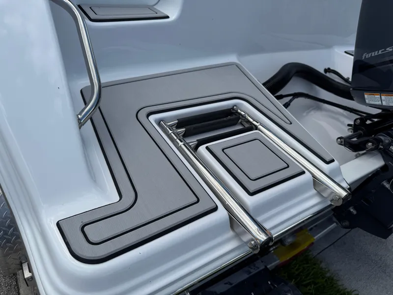 Slide: The Image of 2023 Sportsman Open 212 Center Console boat with a sleek swim platform and ladder. - 6