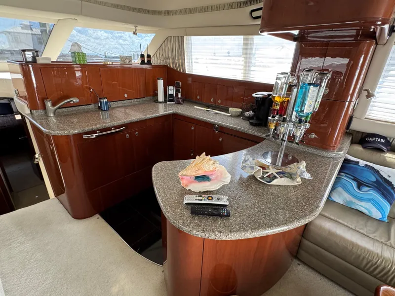 Slide: The Image of Luxurious 2004 Sea Ray 560 Sedan Bridge yacht interior with modern kitchen amenities. - 11