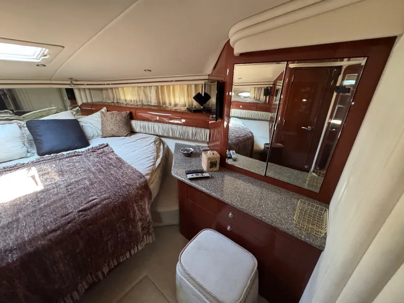 Slide: The Image of Luxurious 2004 Sea Ray 560 Sedan Bridge bedroom with elegant decor and cozy bedding. - 17