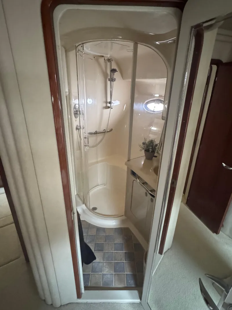Slide: The Image of 2004 Sea Ray 560 Sedan Bridge yacht bathroom with shower and vanity. - 22