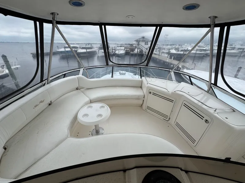 Slide: The Image of Luxurious 2004 Sea Ray 560 Sedan Bridge yacht interior with panoramic marina view. - 34