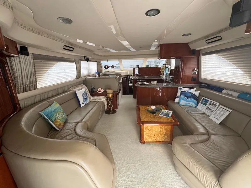 Slide: The Image of Luxurious interior of a 2004 Sea Ray 560 Sedan Bridge yacht with elegant seating and decor. - 5
