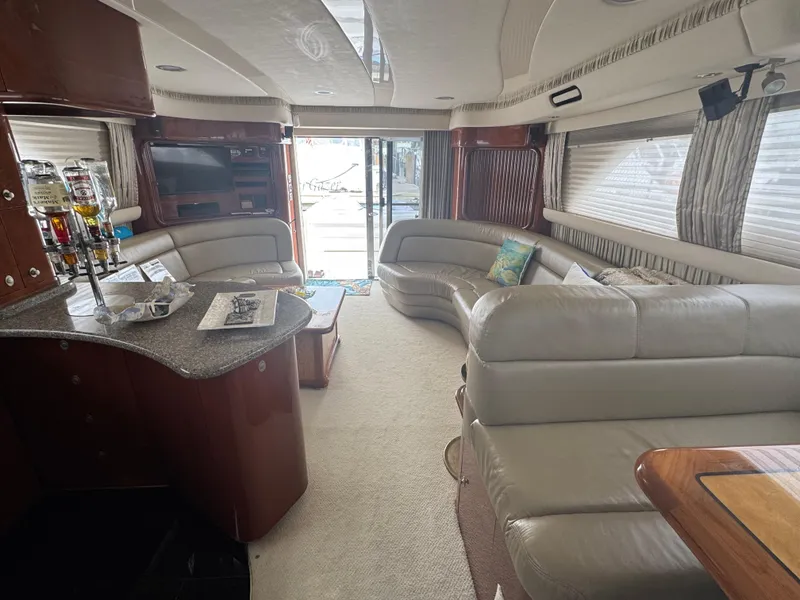 Slide: The Image of Luxurious interior of a 2004 Sea Ray 560 Sedan Bridge yacht with plush seating and modern amenities. - 6