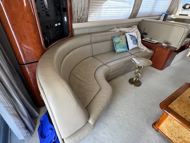 Slide: The Image of Luxurious interior of a 2004 Sea Ray 560 Sedan Bridge yacht with leather seating. - 7