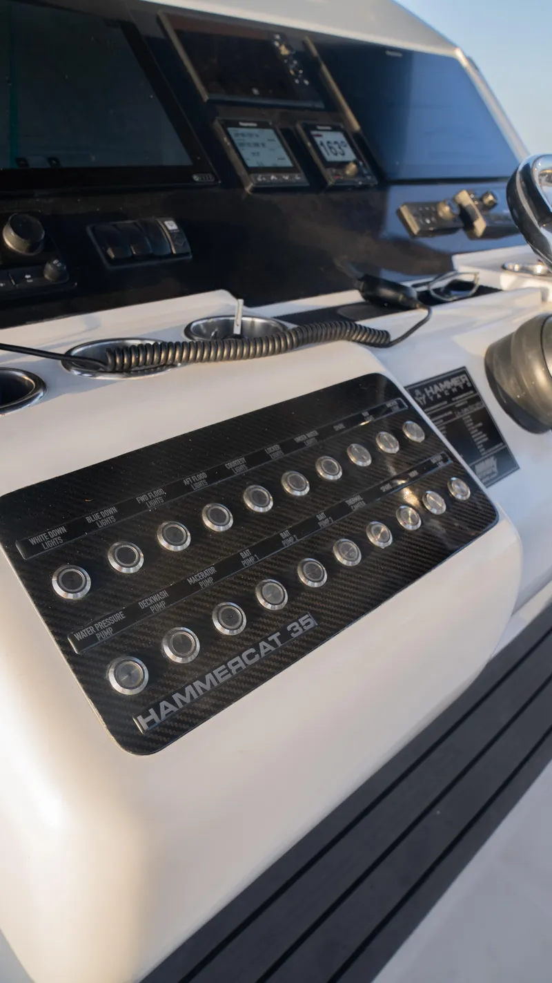 Slide: The Image of Control panel of 2025 Hammer Yachts HammerCat 35, featuring modern navigation instruments. - 10