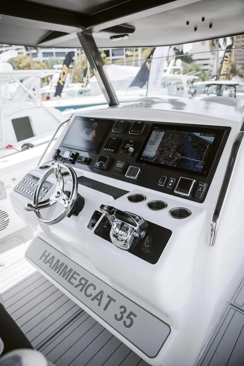 Slide: The Image of 2025 Hammer Yachts HammerCat 35 helm with advanced navigation controls and sleek design. - 5