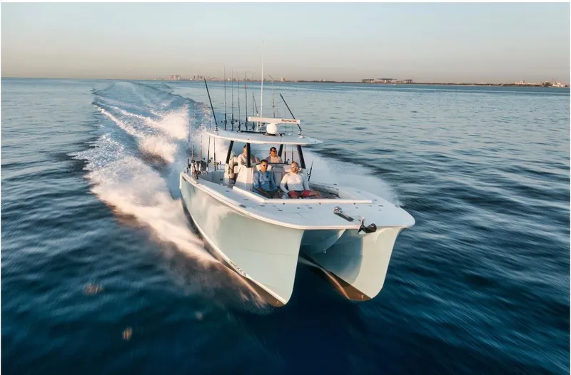 Slide: The Image of 2025 Hammer Yachts HammerCat 35 cruising on open water at high speed. - 7