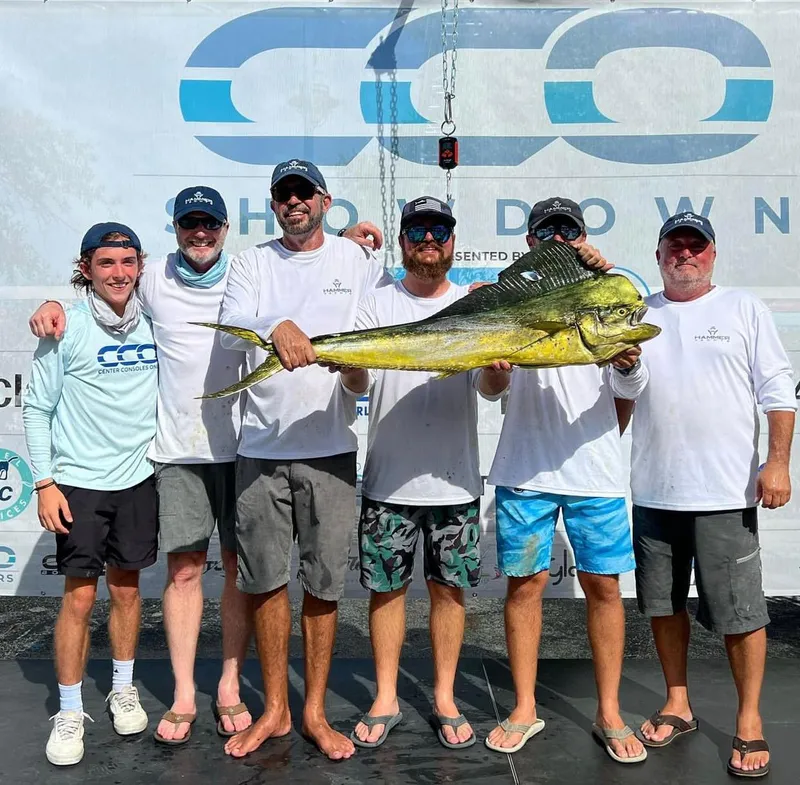 Slide: The Image of Group of fishermen holding a large fish at a fishing event, HammerCat 35, 2025. - 15