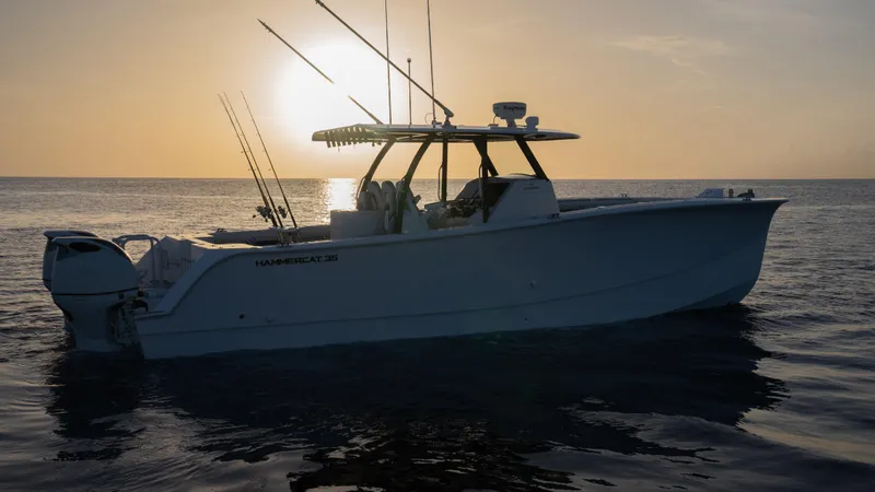 Slide: The Image of 2025 Hammer Yachts HammerCat 35 at sunset on calm waters. - 18