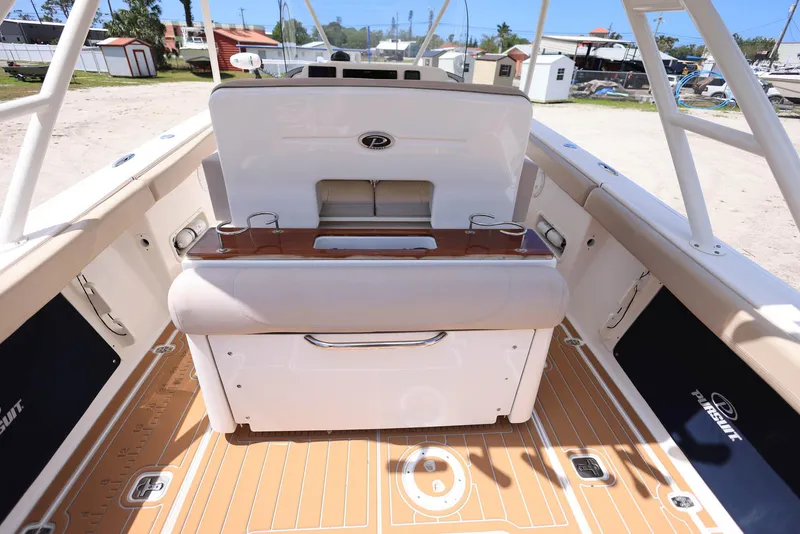 Slide: The Image of 2015 Pursuit S 280 Sport boat interior with seating and storage compartments. - 19