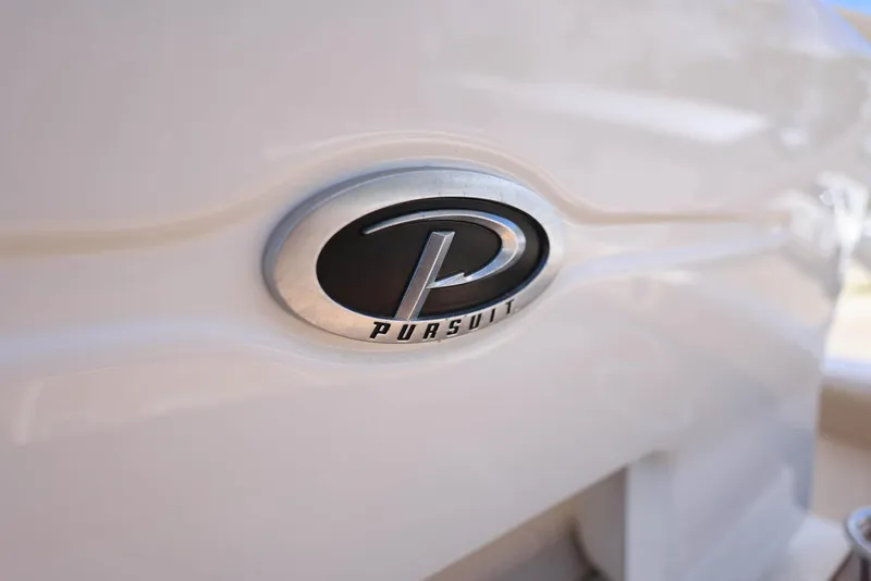 Slide: The Image of 2015 Pursuit S 280 Sport boat emblem on white surface. - 21
