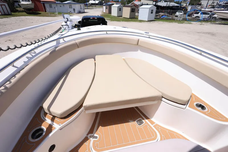 Slide: The Image of 2015 Pursuit S 280 Sport boat with cushioned seating and teak-style flooring. - 30