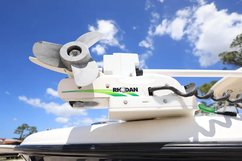 Slide: The Image of Rhodan trolling motor on 2015 Pursuit S 280 Sport boat under blue sky. - 43