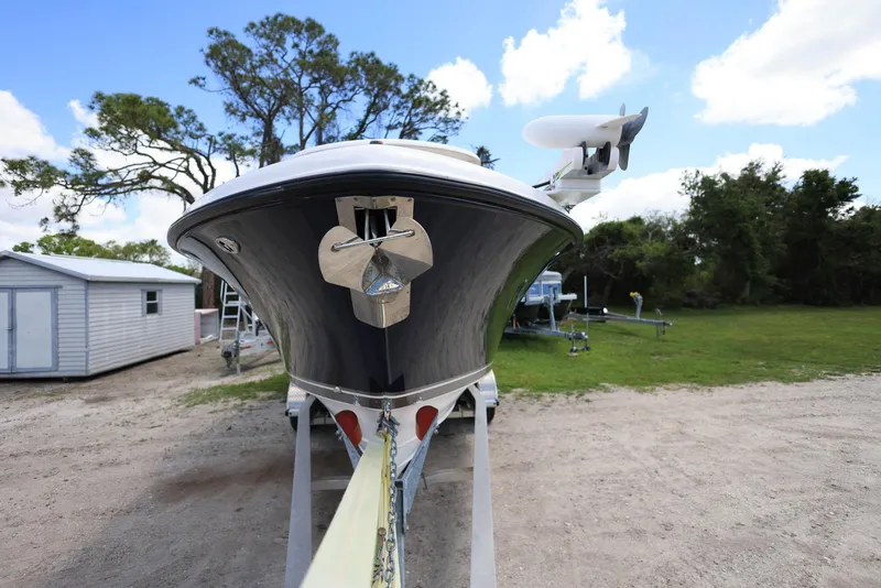 Slide: The Image of 2015 Pursuit S 280 Sport boat on trailer, front view, outdoors. - 6
