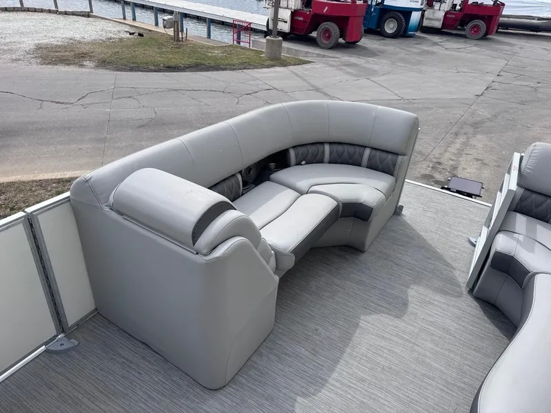 Slide: The Image of 2022 Bennington LX24FB pontoon boat with gray seating and spacious deck. - 10