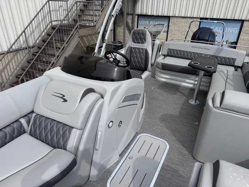 Slide: The Image of 2022 Bennington LX24FB pontoon boat interior with luxurious seating and modern design. - 14