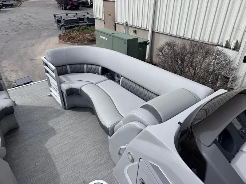 Slide: The Image of 2022 Bennington LX24FB pontoon boat with luxurious gray seating and modern design. - 9