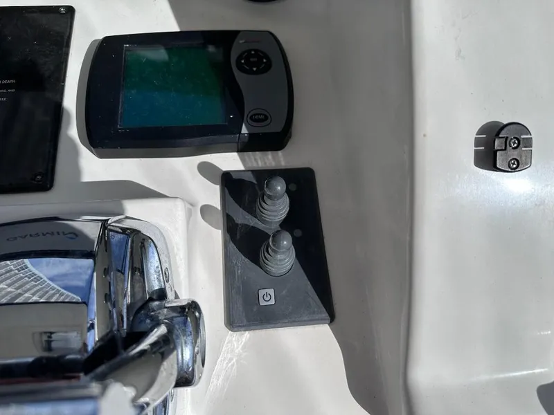Slide: The Image of Control panel of a 2007 Sea Ray 360 Sedan Bridge boat with joystick and display. - 12