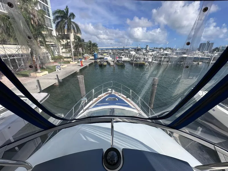Slide: The Image of 2007 Sea Ray 360 Sedan Bridge yacht docked at marina, view from helm. - 16