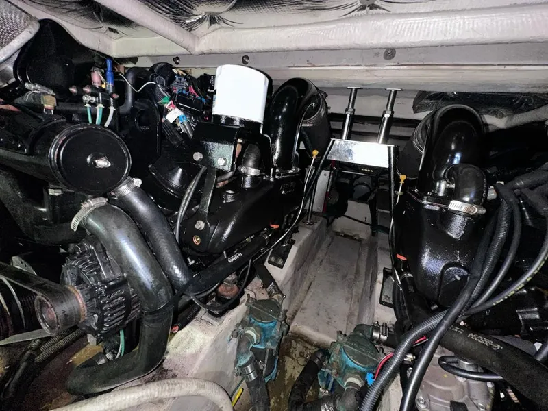Slide: The Image of Engine room of a 2007 Sea Ray 360 Sedan Bridge with visible components and wiring. - 19