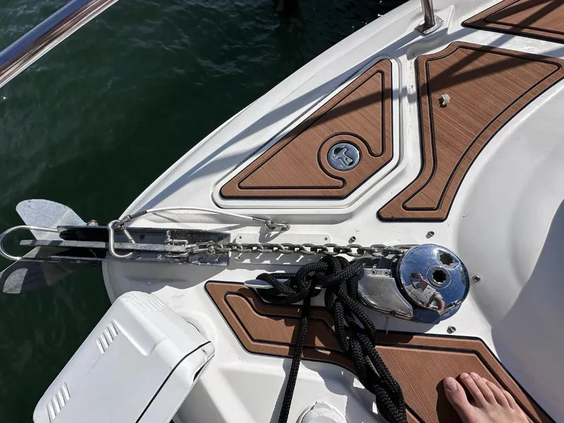Slide: The Image of 2007 Sea Ray 360 Sedan Bridge anchor area with teak decking and stainless steel fittings. - 2