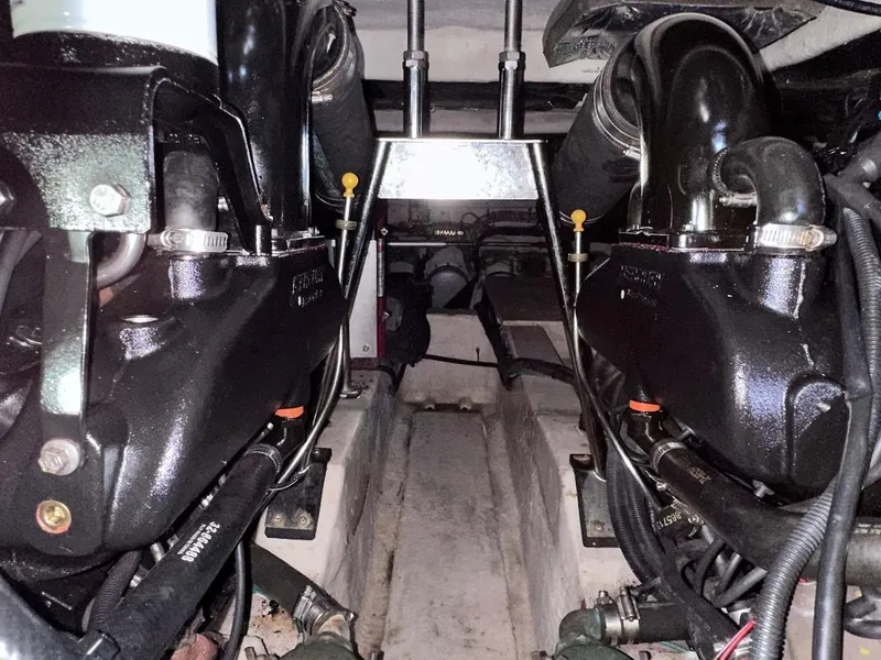 Slide: The Image of Engine compartment of a 2007 Sea Ray 360 Sedan Bridge boat, showcasing mechanical components. - 21