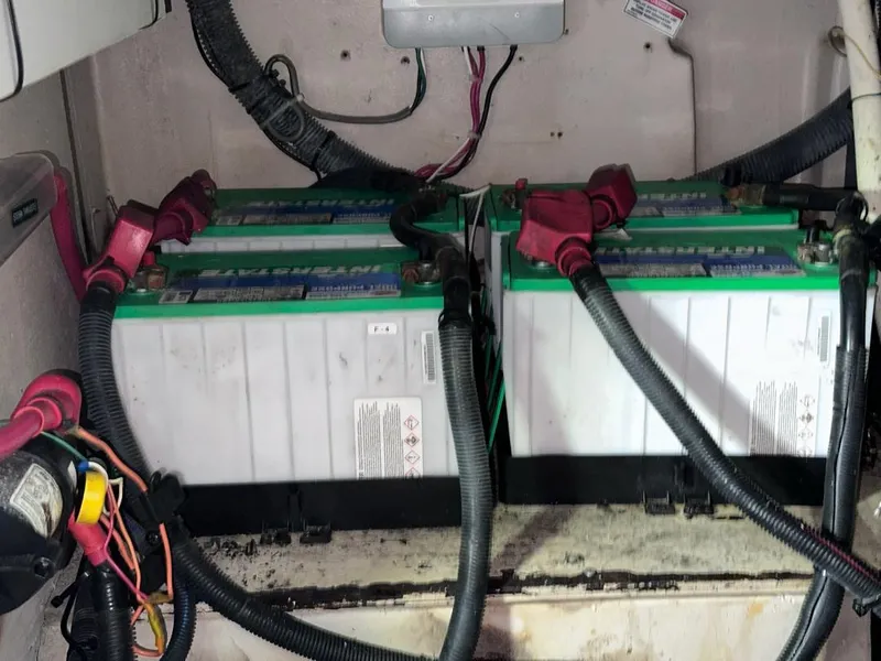 Slide: The Image of Battery compartment of a 2007 Sea Ray 360 Sedan Bridge with connected cables. - 25
