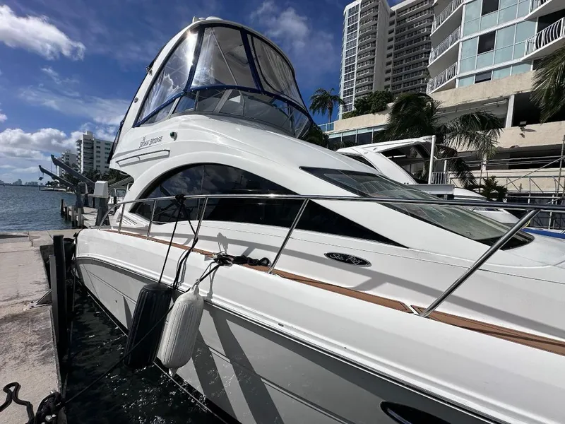 Slide: The Image of 2007 Sea Ray 360 Sedan Bridge yacht docked near waterfront buildings. - 26