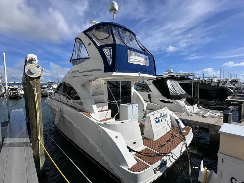 Slide: The Image of 2007 Sea Ray 360 Sedan Bridge yacht docked at marina under blue sky. - 27
