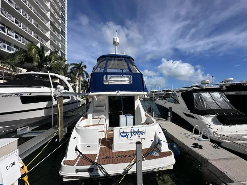 Slide: The Image of 2007 Sea Ray 360 Sedan Bridge yacht docked at marina under blue sky. - 6