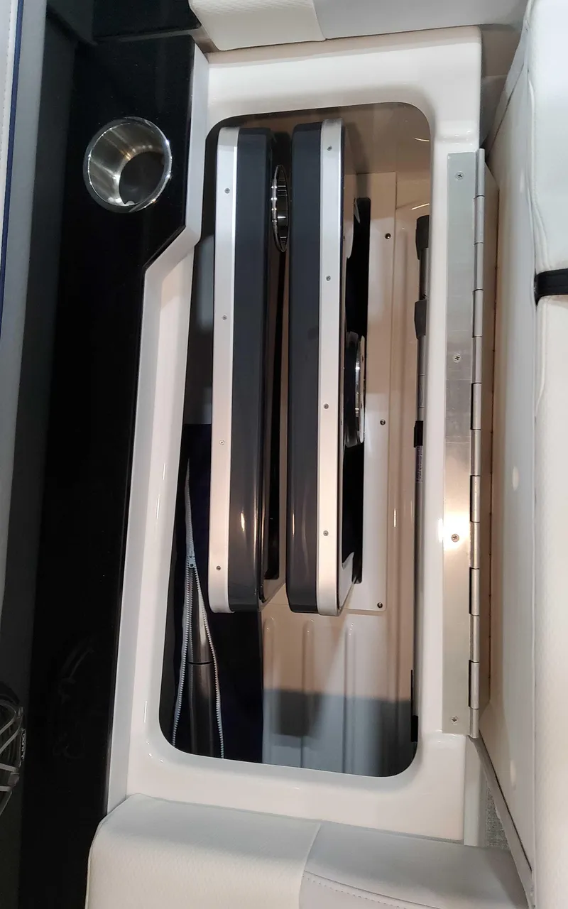 Slide: The Image of 2025 Formula 310 Bowrider interior storage compartment with sleek design and modern features. - 12