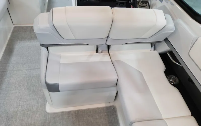 Slide: The Image of 2025 Formula 310 Bowrider interior seating with modern white upholstery. - 13
