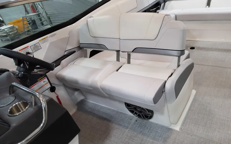 Slide: The Image of 2025 Formula 310 Bowrider interior with modern seating and steering wheel. - 14