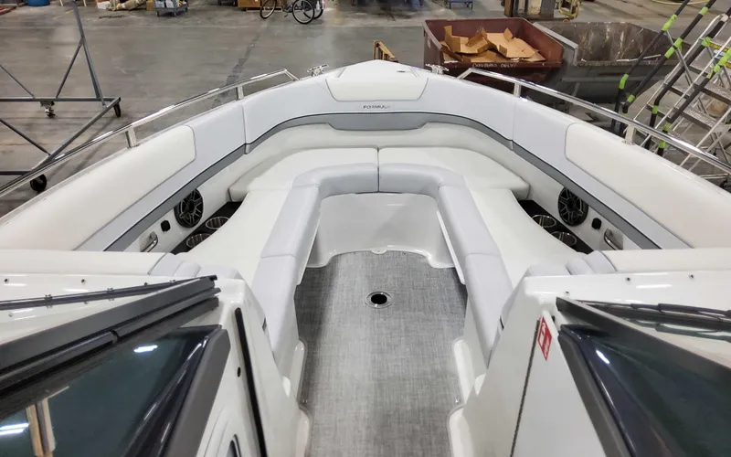 Slide: The Image of 2025 Formula 310 Bowrider boat interior with spacious seating and modern design. - 23