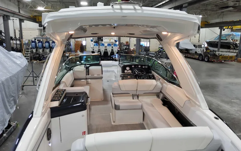 Slide: The Image of 2025 Formula 310 Bowrider interior, spacious seating, modern design, in a showroom setting. - 6