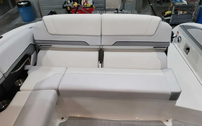 Slide: The Image of 2025 Formula 310 Bowrider interior seating, featuring sleek white upholstery and modern design. - 7