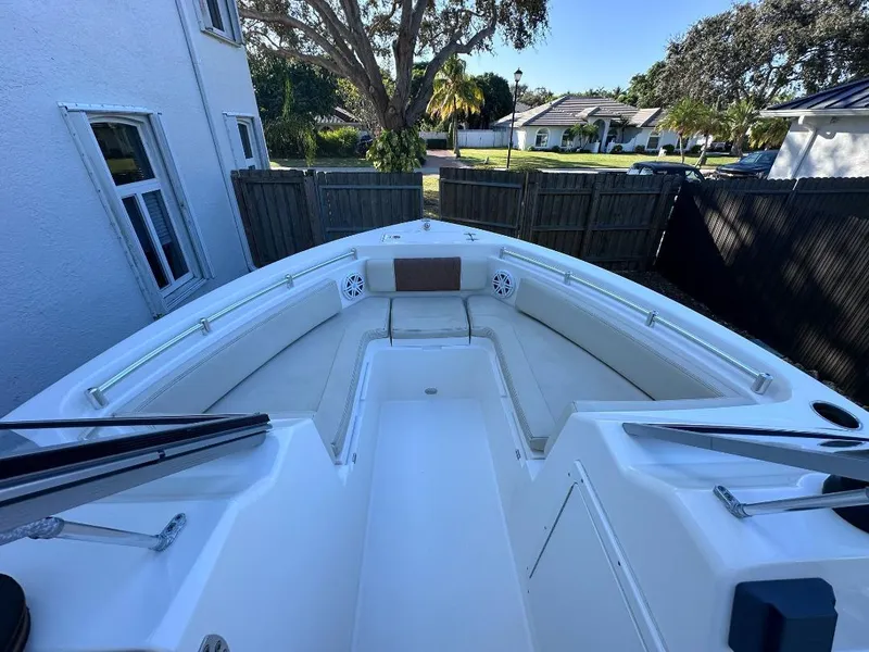 Slide: The Image of 2022 Cobia 220 DC boat interior with spacious seating and modern design. - 20